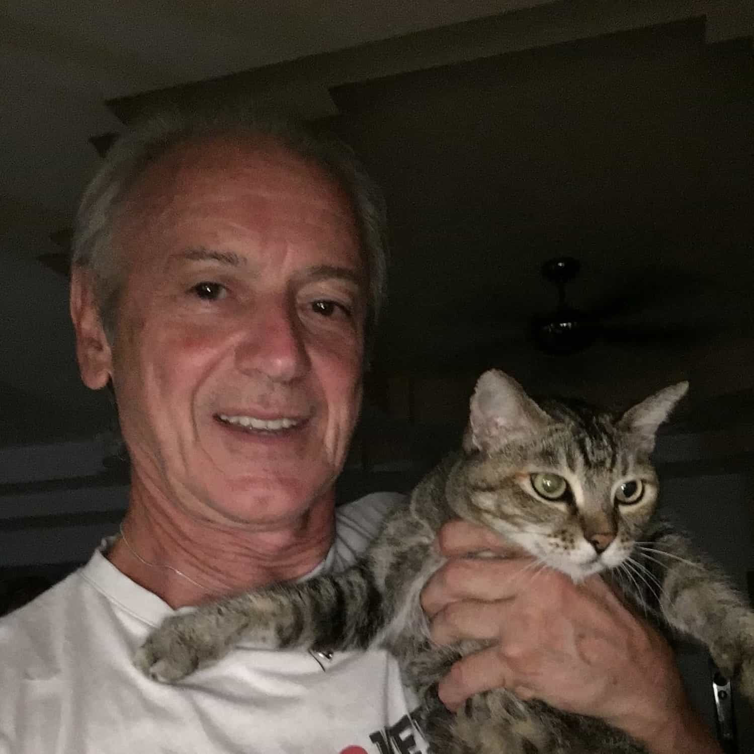 man holding a cat