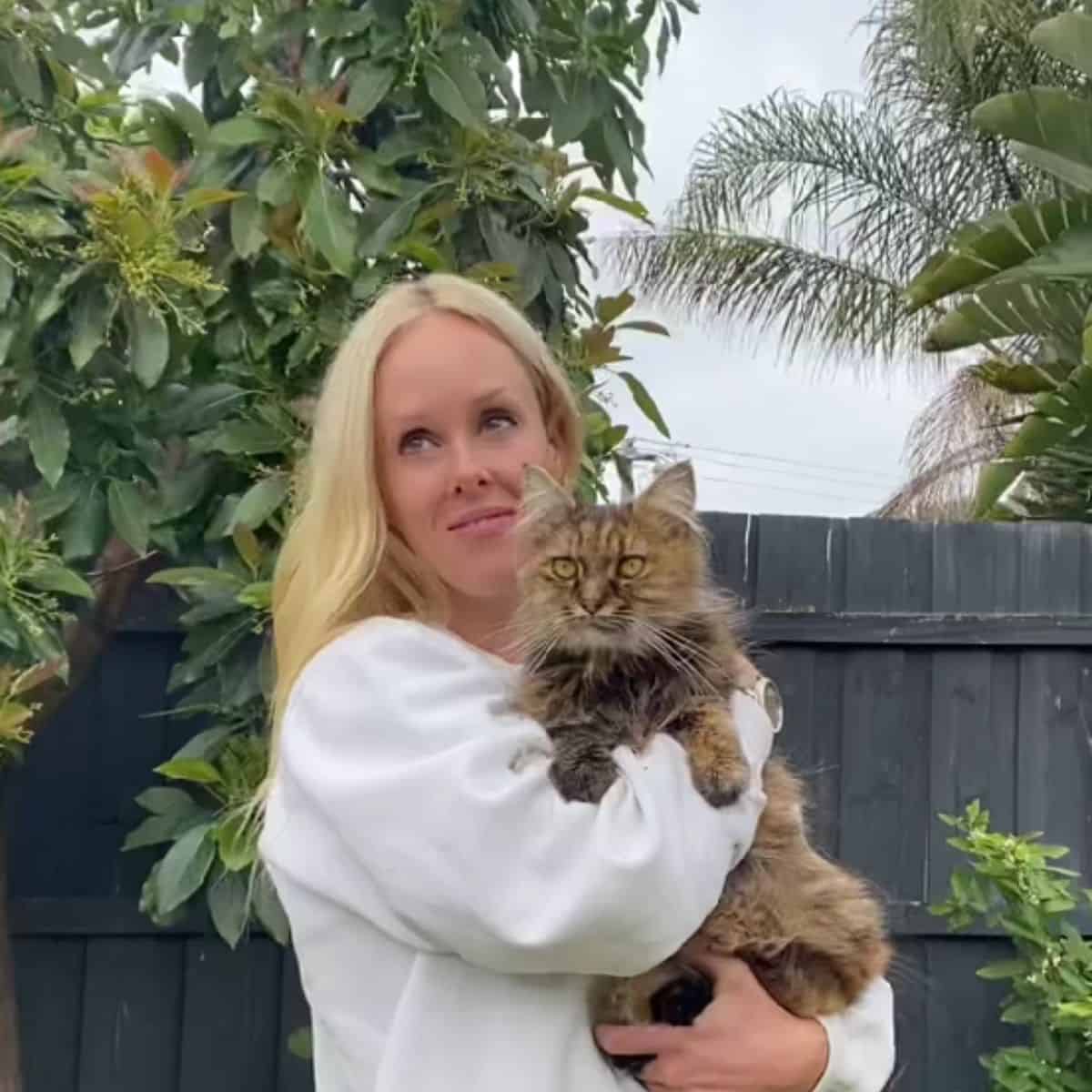 woman holding a cat