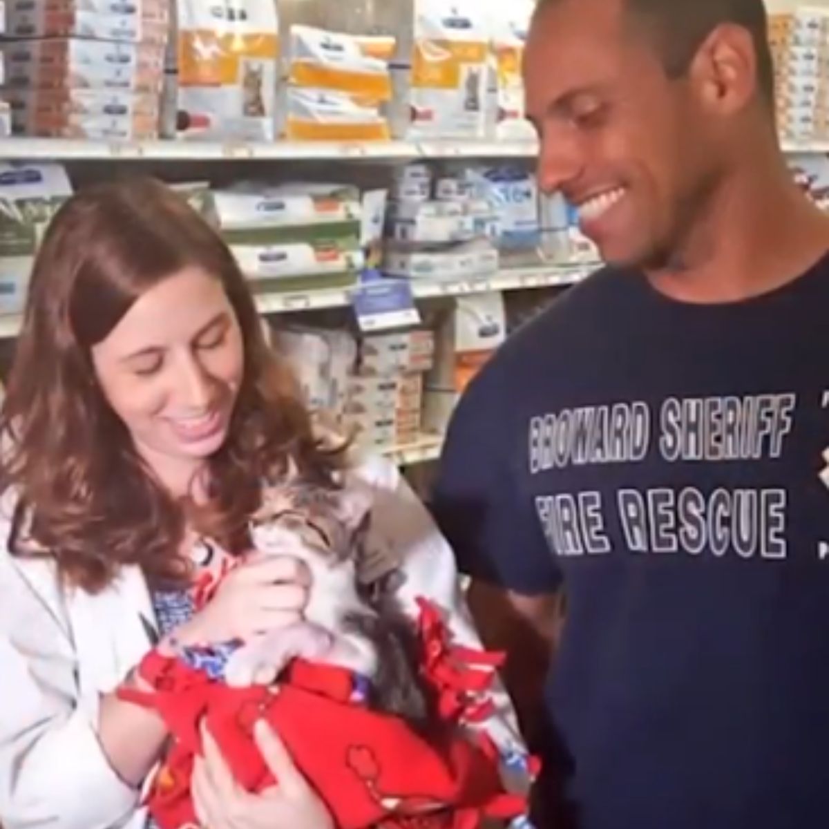 happy couple and kitten