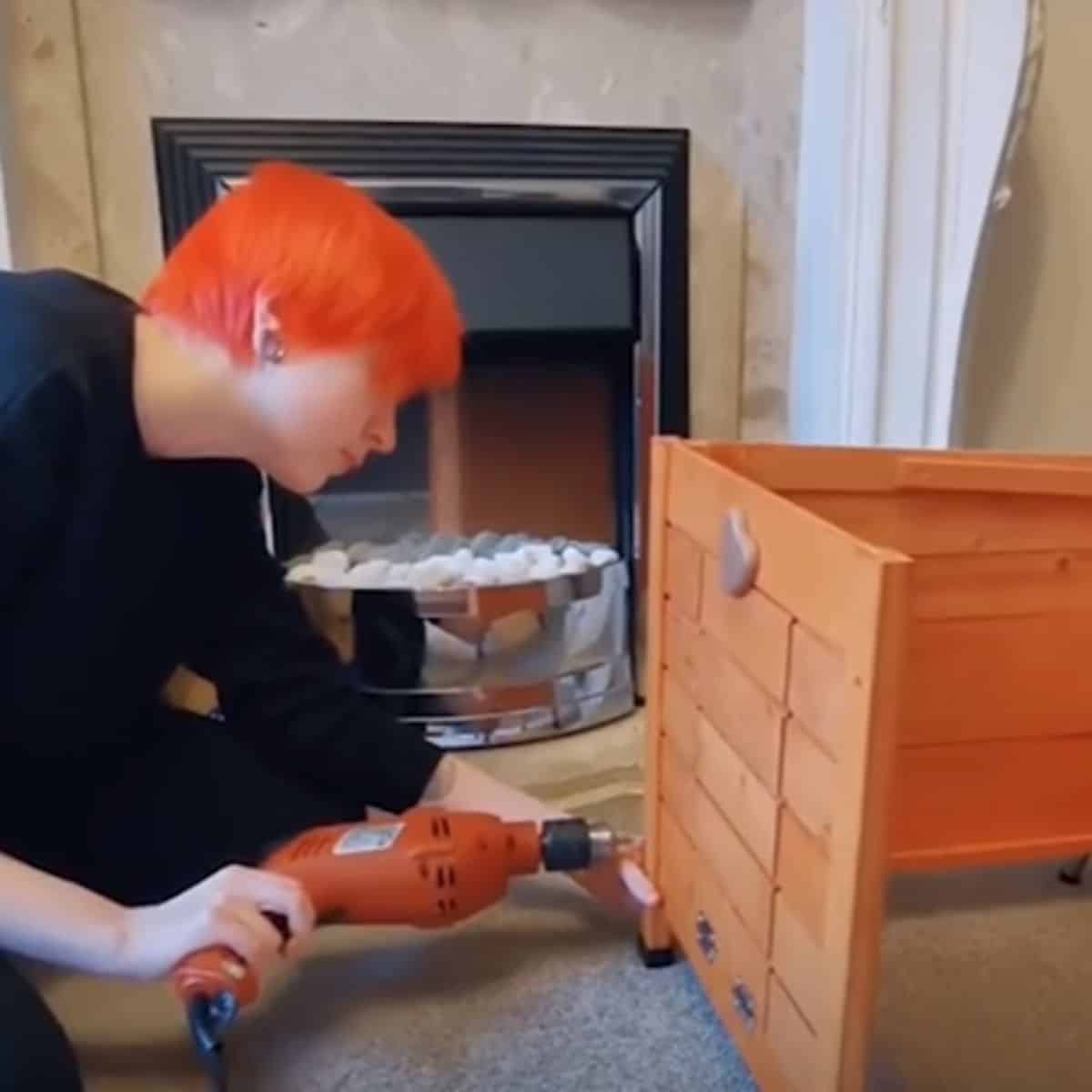 a woman makes a box for a cat