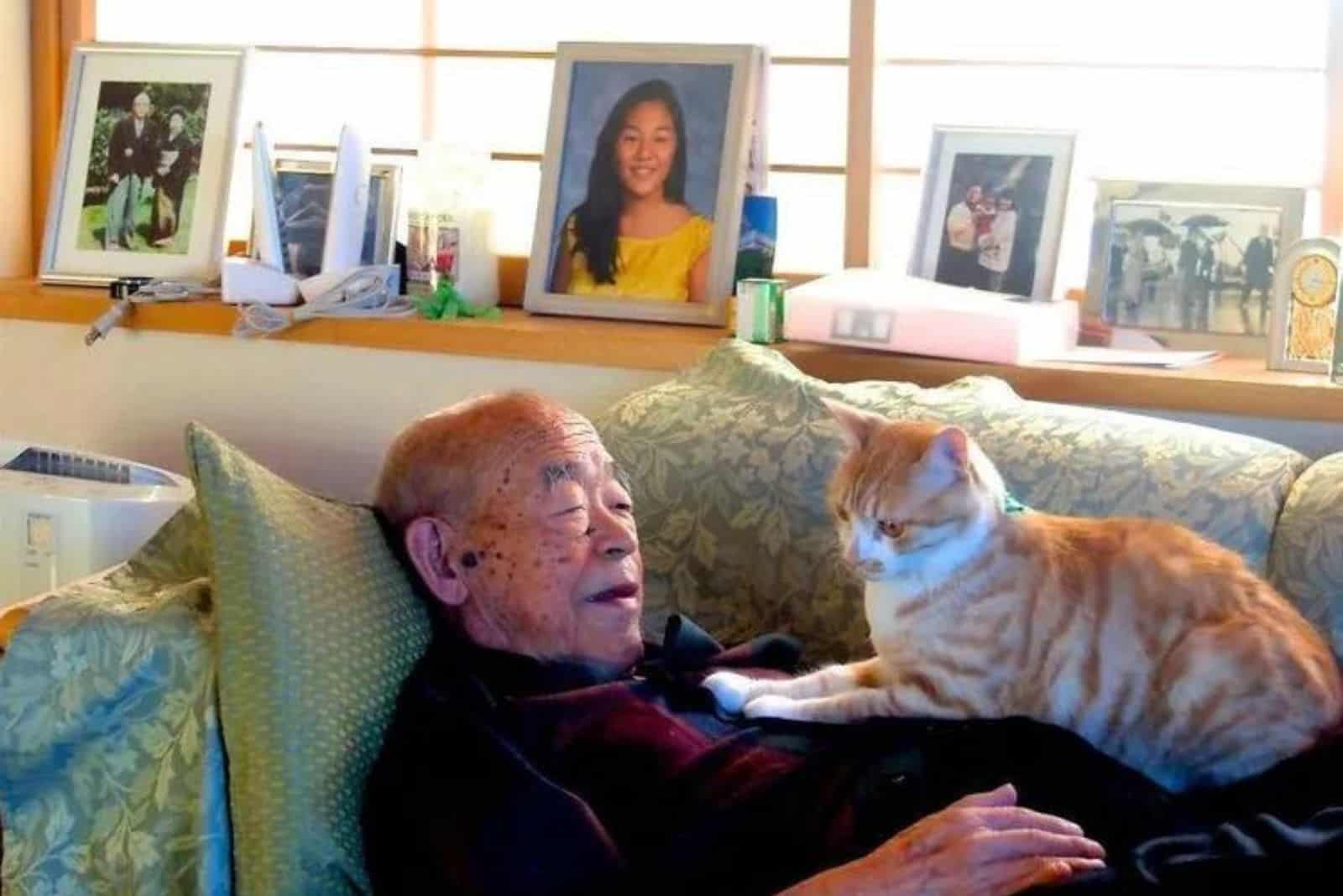 cat laying on man's chest