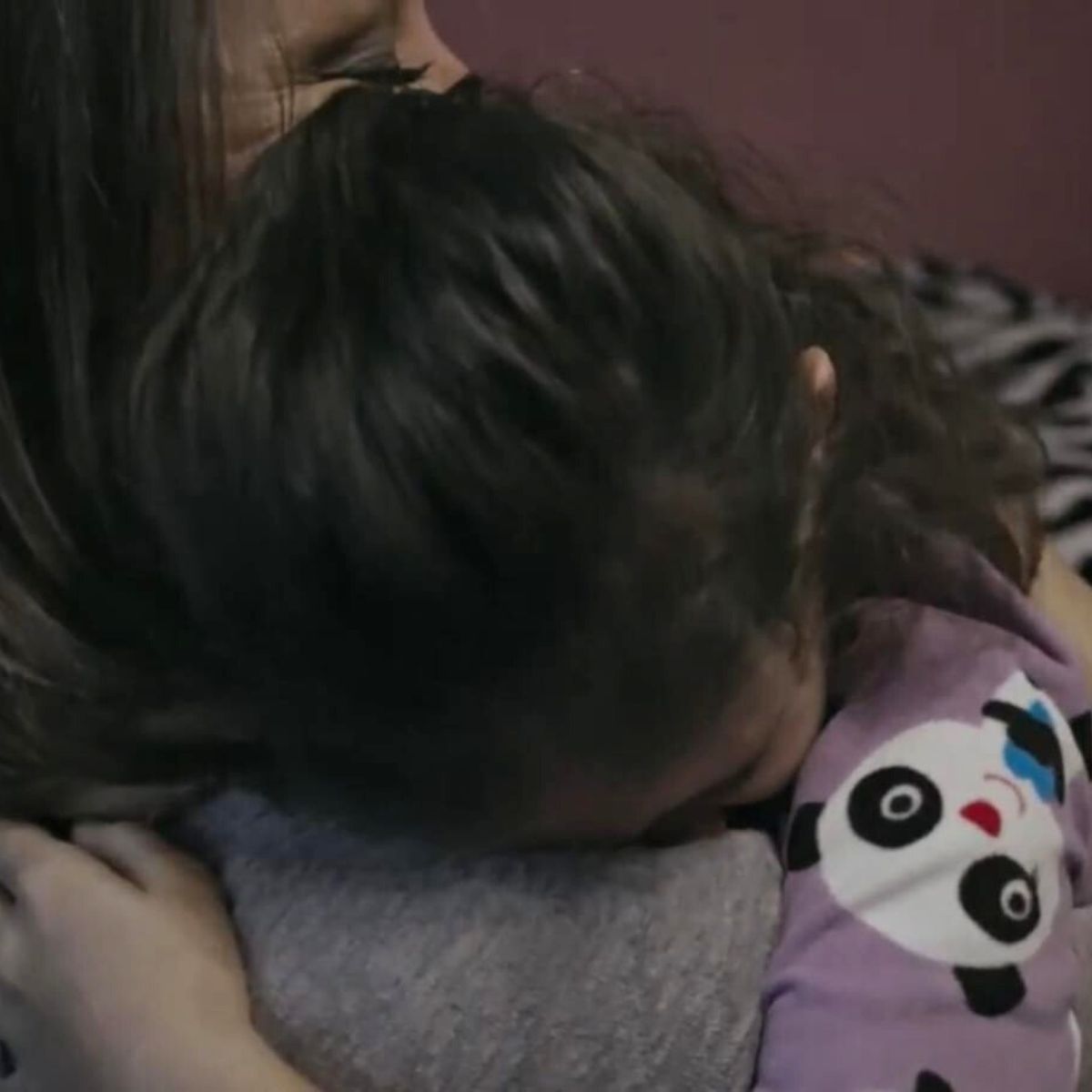 girl and mom hugging