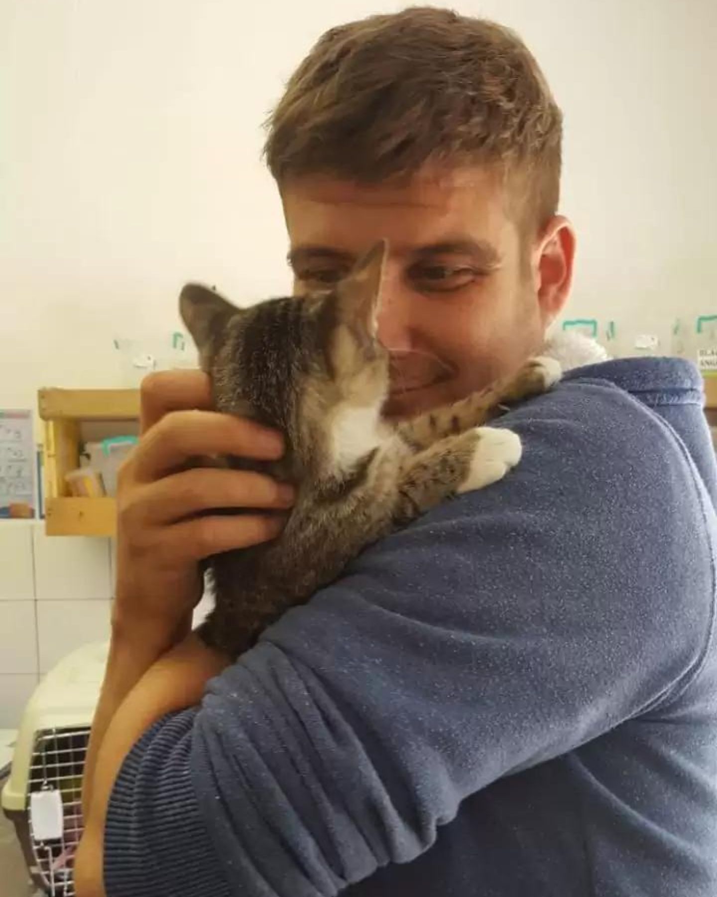 man holding a kitten