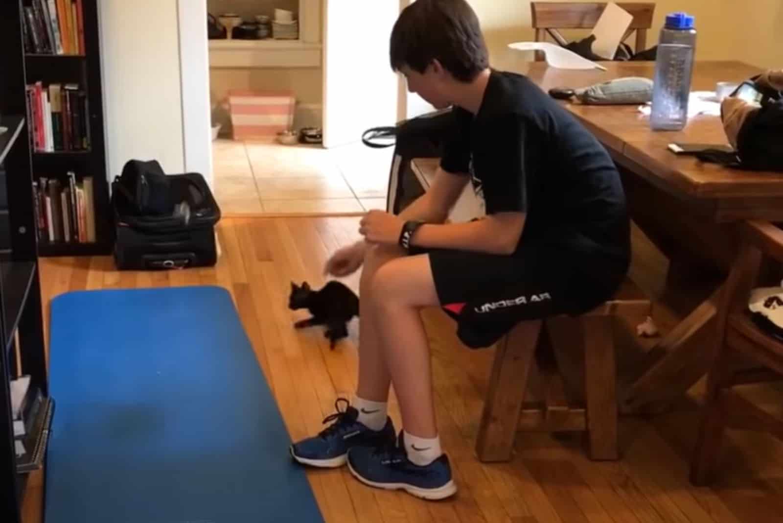 photo of boy and tetley in living room