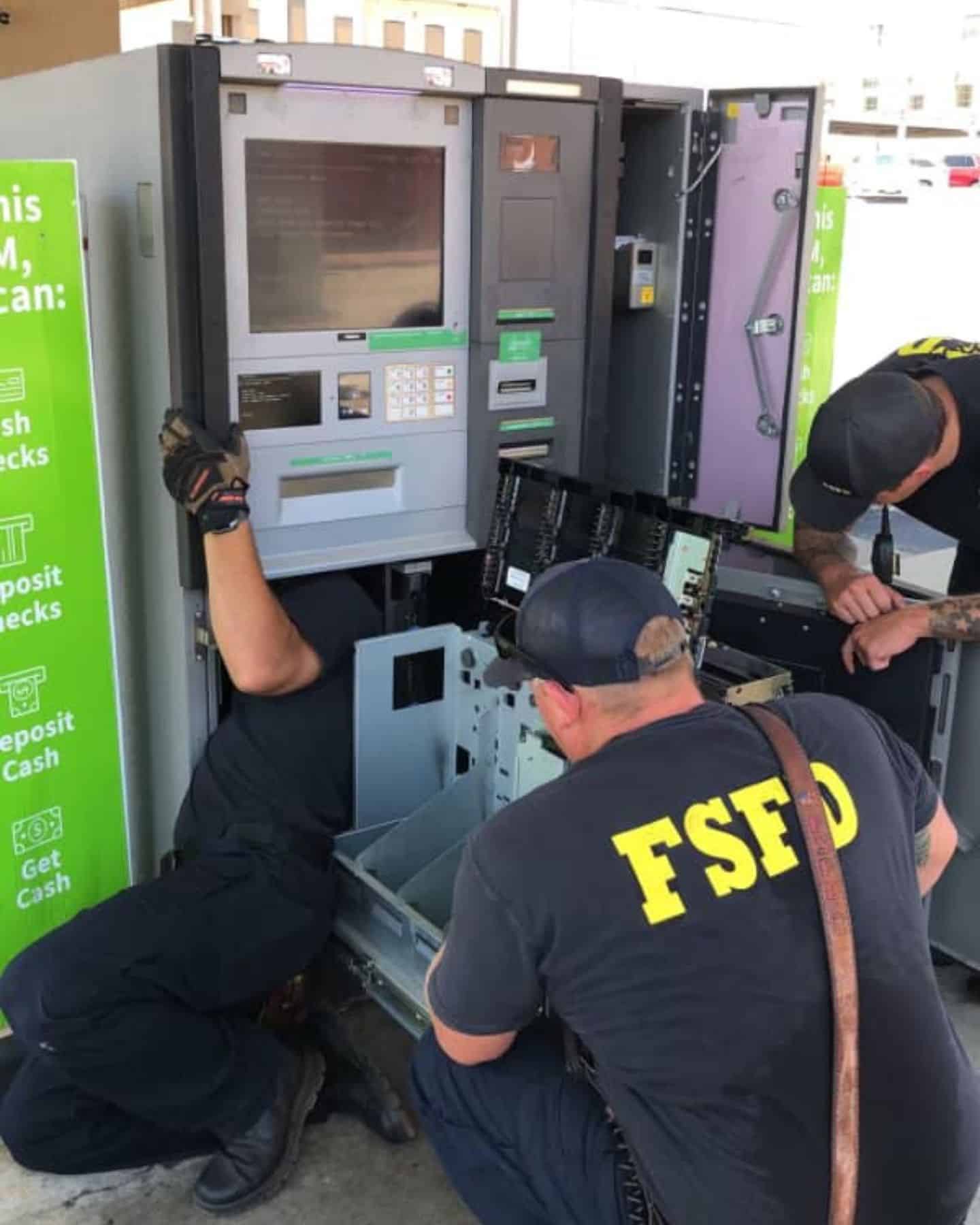 photo of firefighters rescuing kitten stuck in ATM