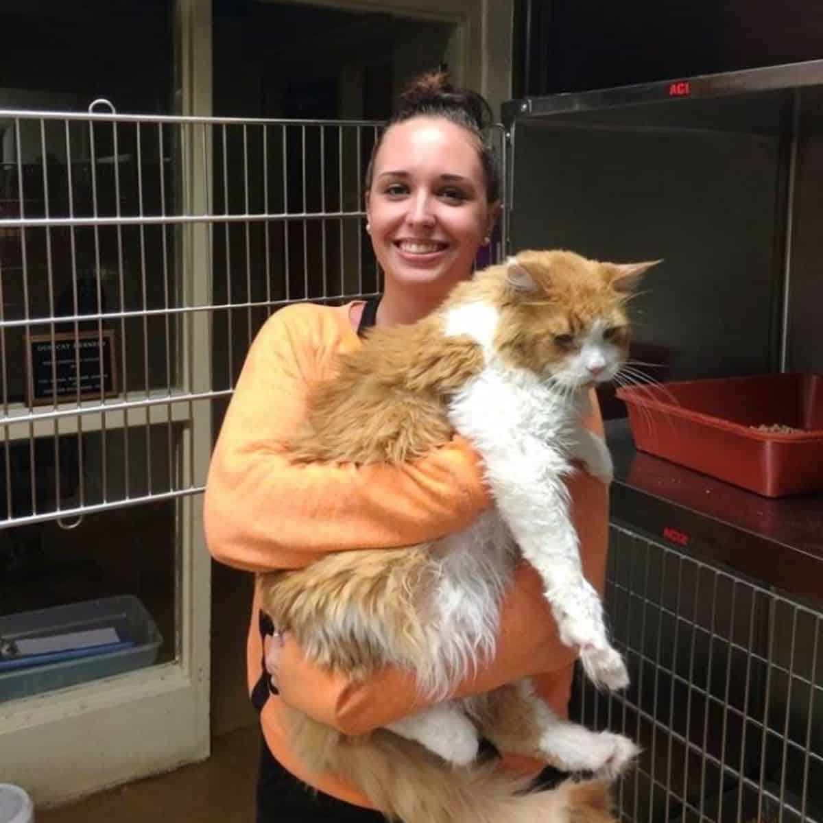 woman holding giant cat named edgar