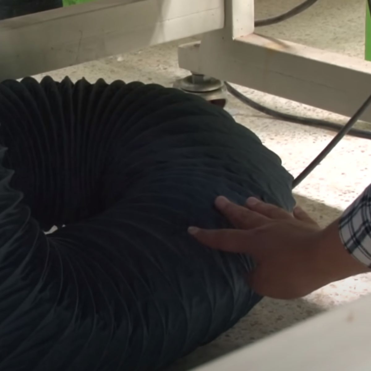 woman pushing a large tube