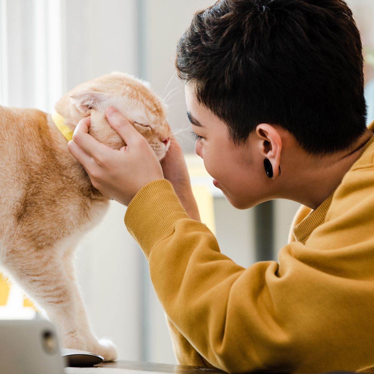 woman with short hair and cat