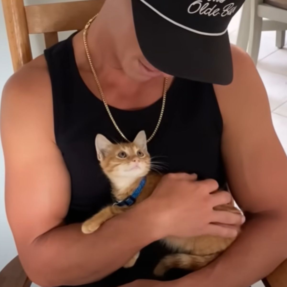 man holding a cat