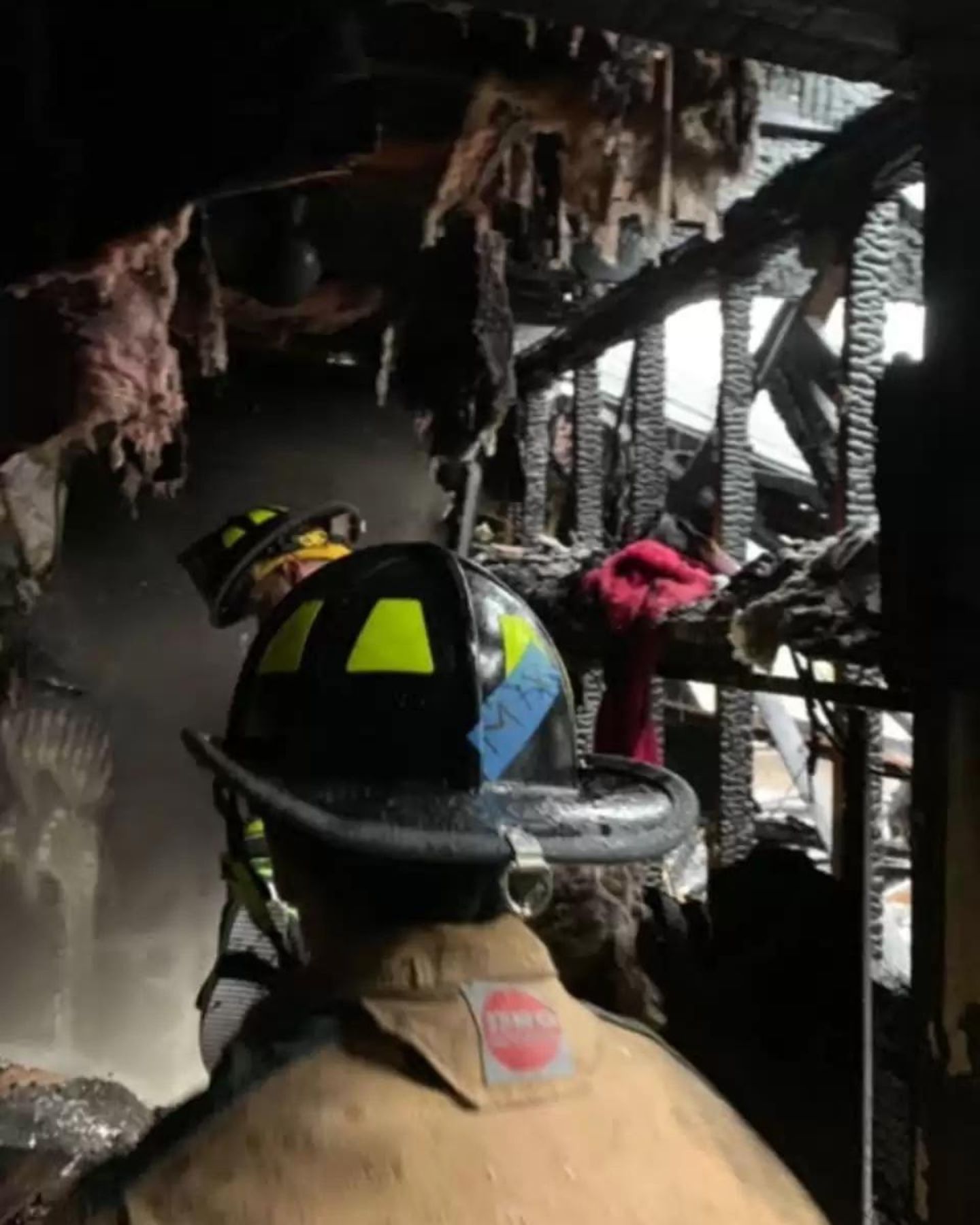 firefighter in burned house