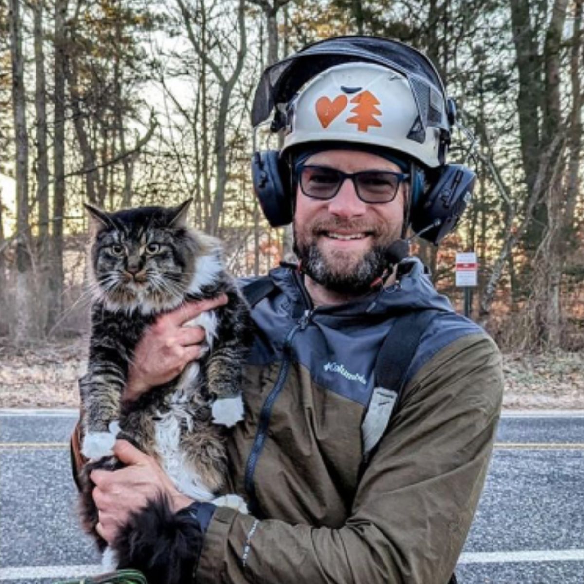 man holding a cat